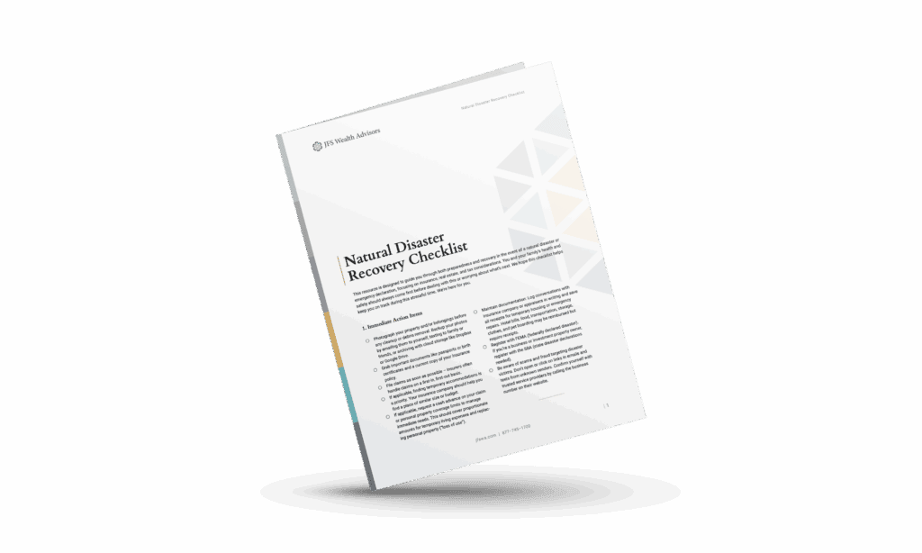 Person reading Natural Disaster Recovery Checklist from JFS Wealth Advisors